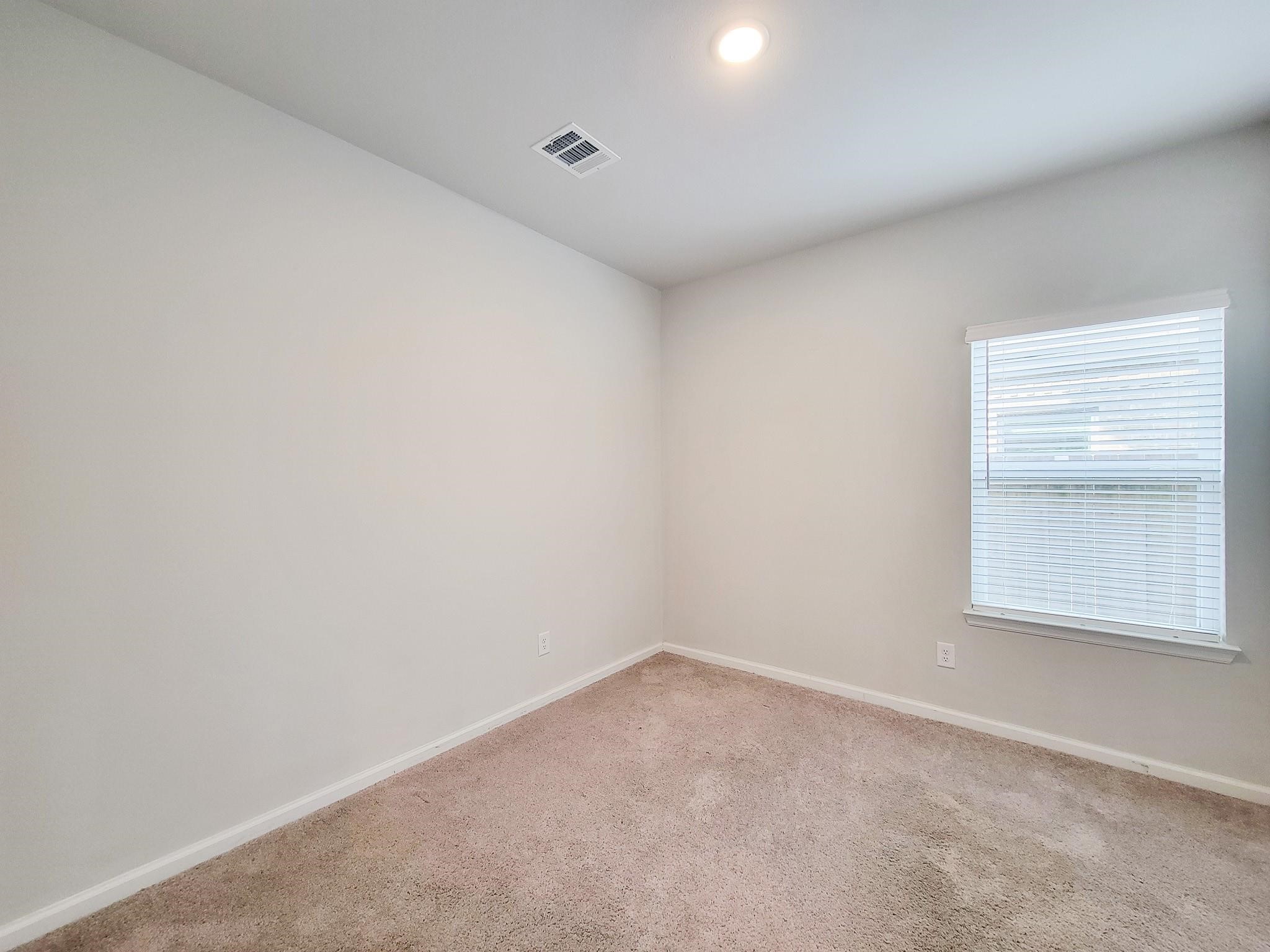 94 Valiant Ridge Trail Magnolia, TX 77354 - Photo 21 of 45 an empty room with a window