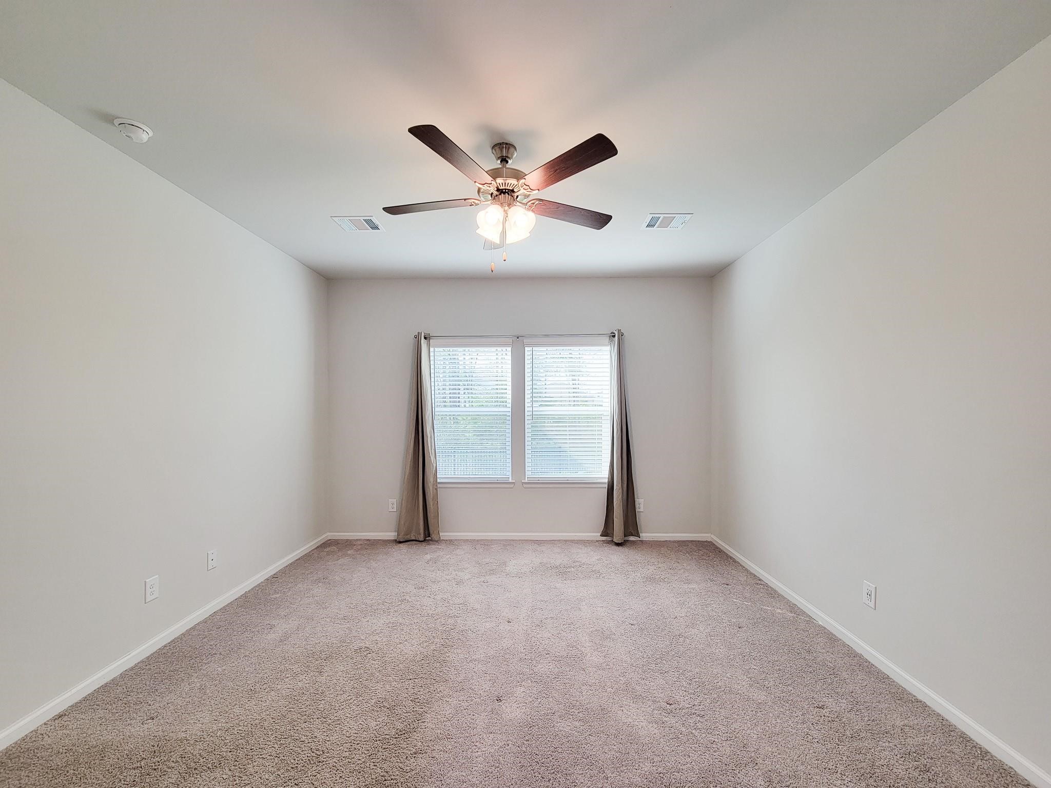 94 Valiant Ridge Trail Magnolia, TX 77354 - Photo 22 of 45 a view of an empty room with a window