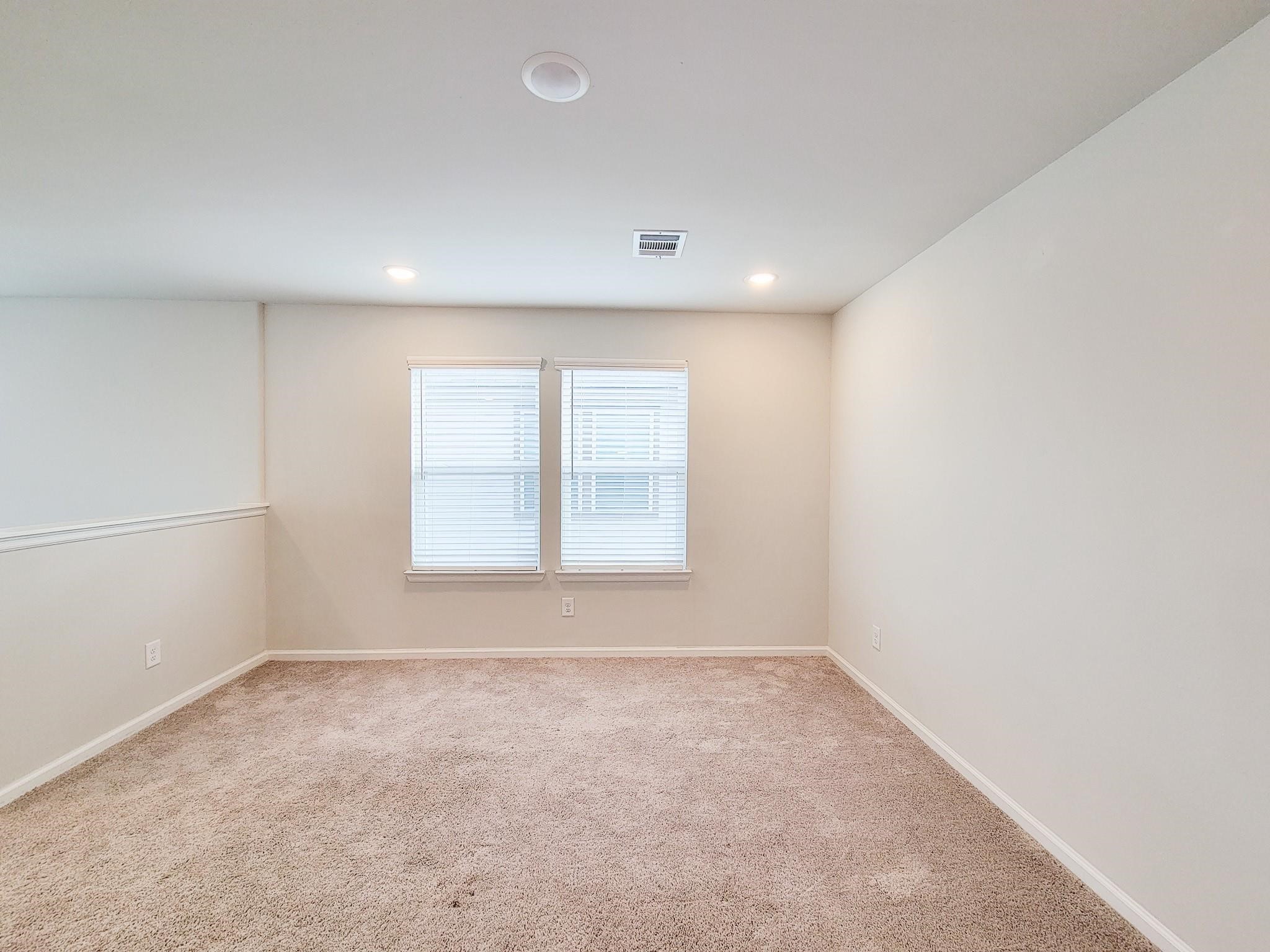 94 Valiant Ridge Trail Magnolia, TX 77354 - Photo 24 of 45 an empty room with a window