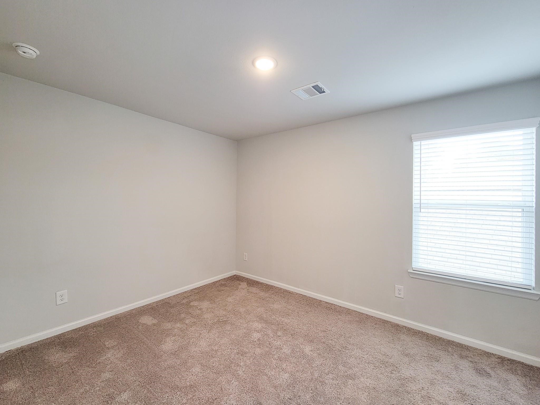 94 Valiant Ridge Trail Magnolia, TX 77354 - Photo 25 of 45 an empty room with a window