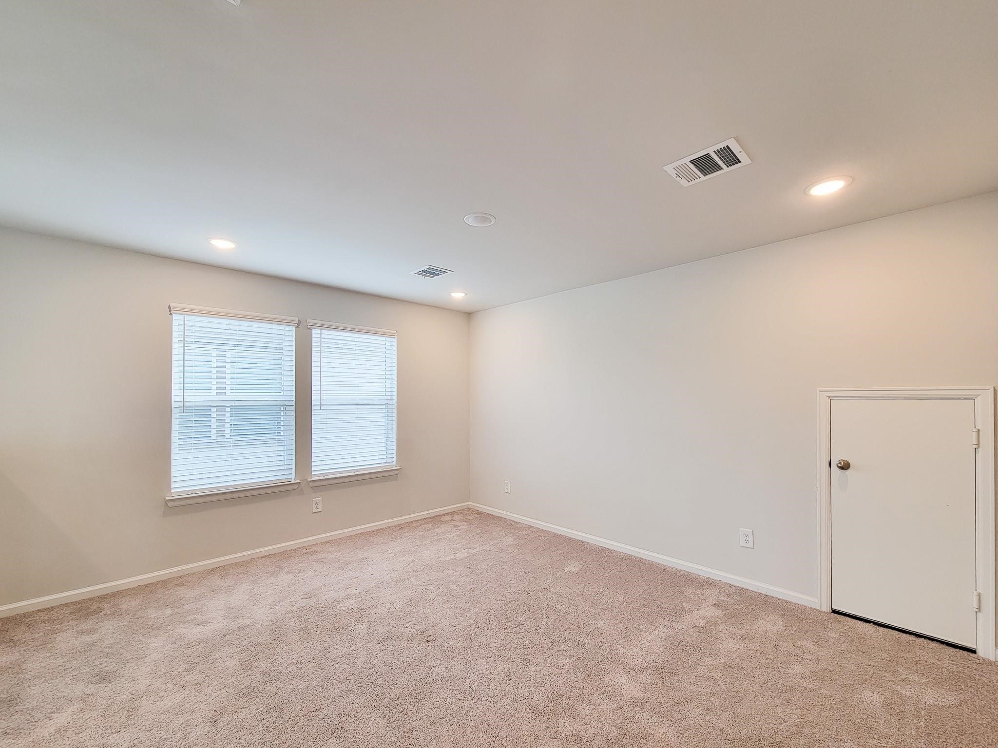 94 Valiant Ridge Trail Magnolia, TX 77354 - Photo 26 of 45 an empty room with a empty space and windows