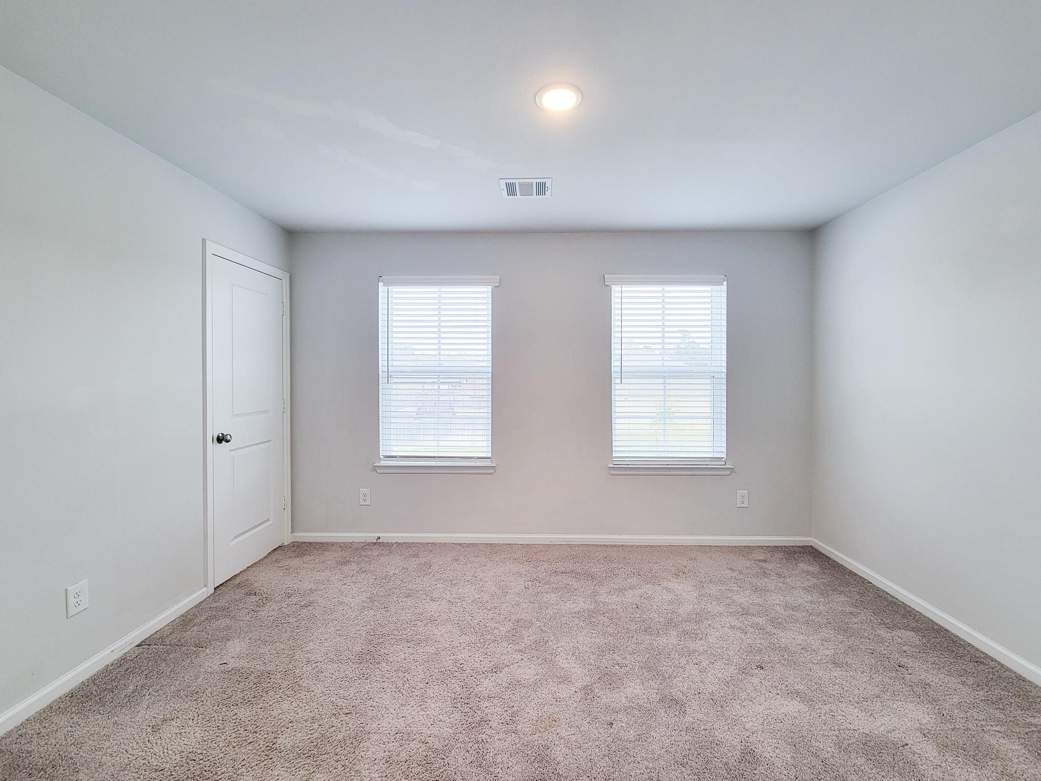 94 Valiant Ridge Trail Magnolia, TX 77354 - Photo 28 of 45 an empty room with windows