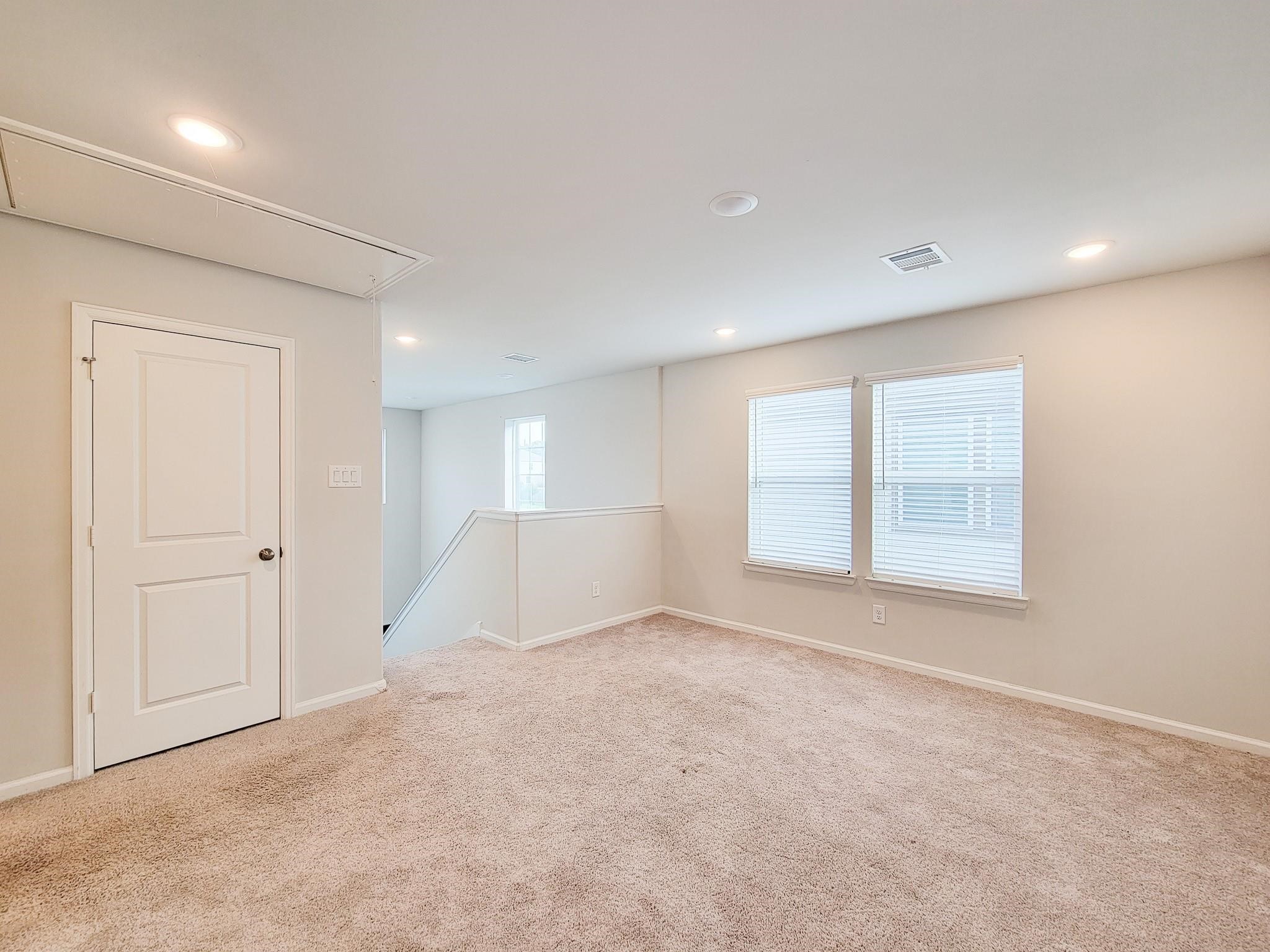 94 Valiant Ridge Trail Magnolia, TX 77354 - Photo 31 of 45 an empty room with windows and closet