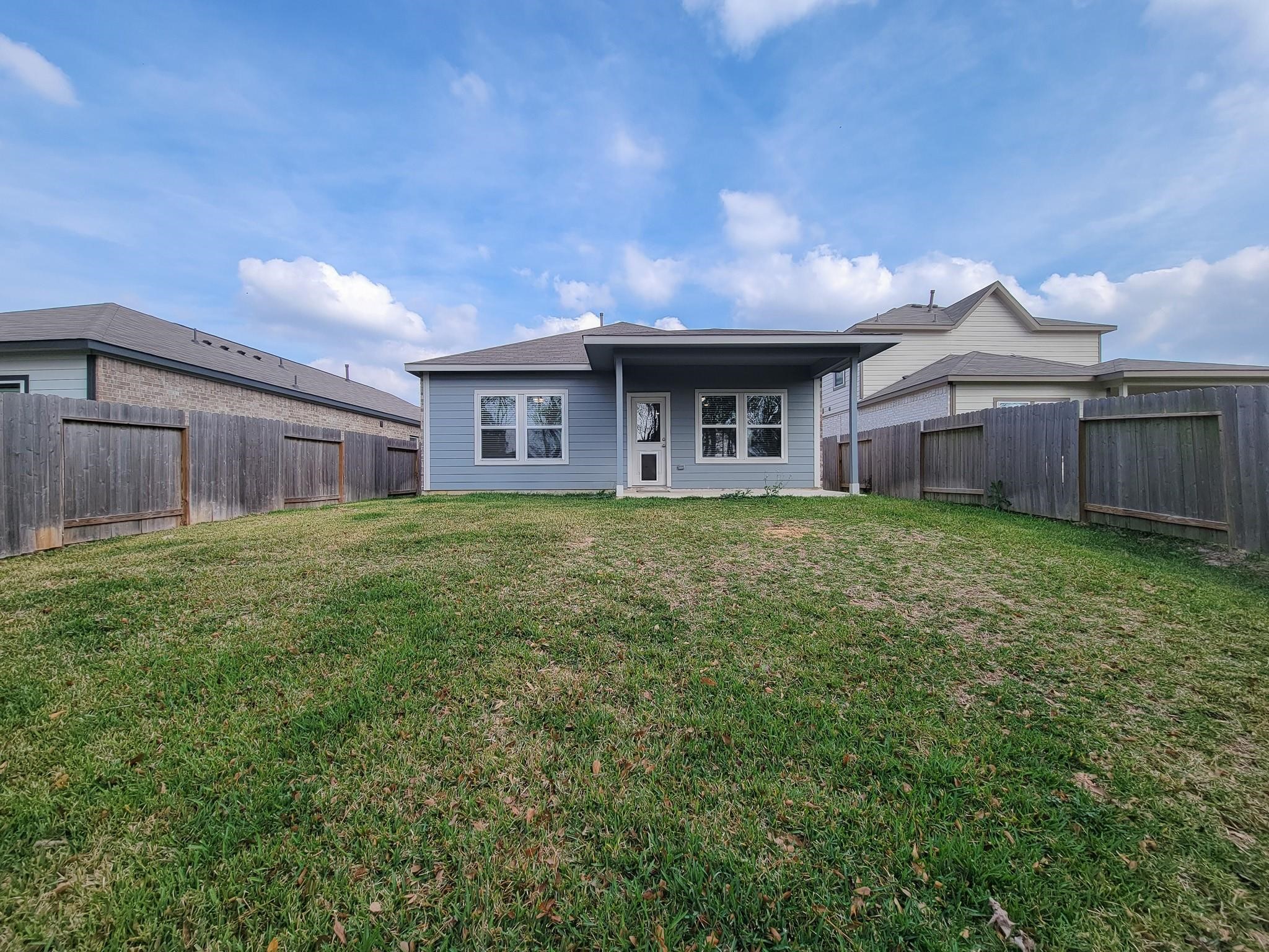 94 Valiant Ridge Trail Magnolia, TX 77354 - Photo 5 of 45 a view of a house with a yard and a large tree