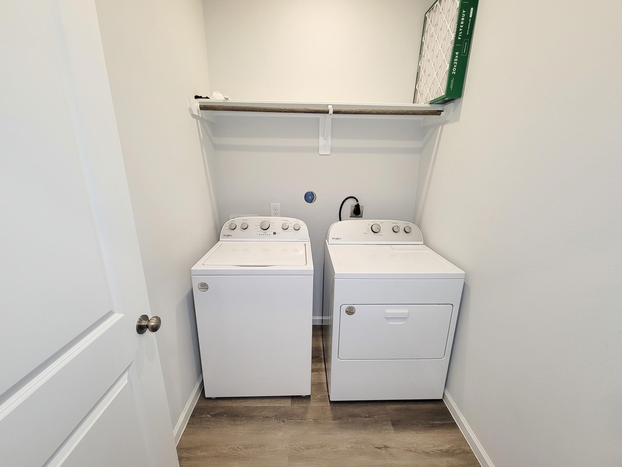 94 Valiant Ridge Trail Magnolia, TX 77354 - Photo 10 of 45 a utility room with dryer and washer