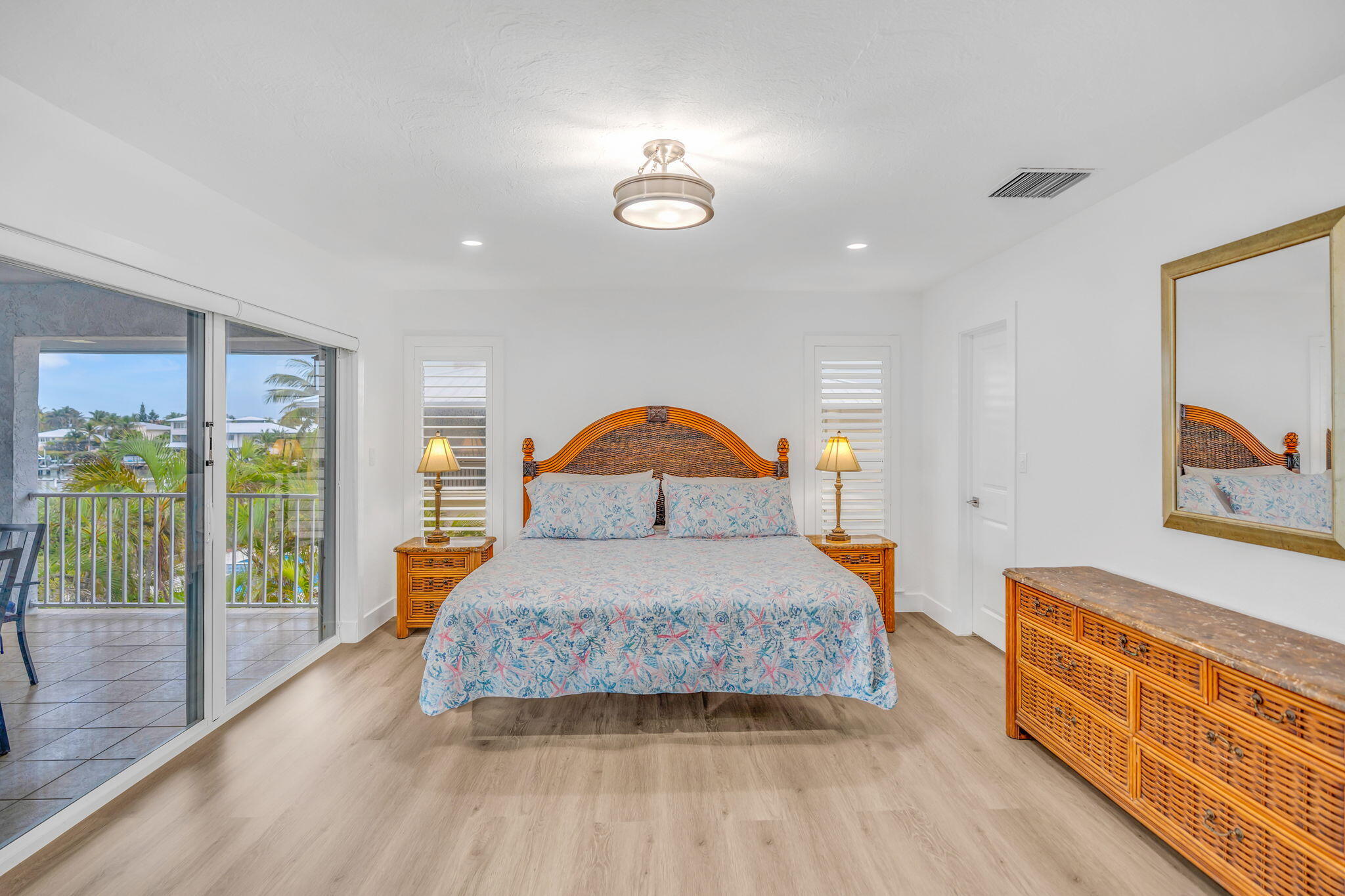 82 Tingler Lane Marathon, FL 33050 - Photo 13 of 54 a bedroom with a bed and wooden floor