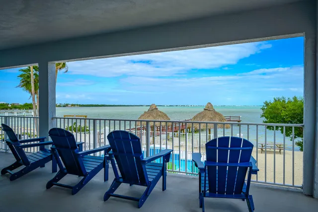 a view of a balcony with furniture