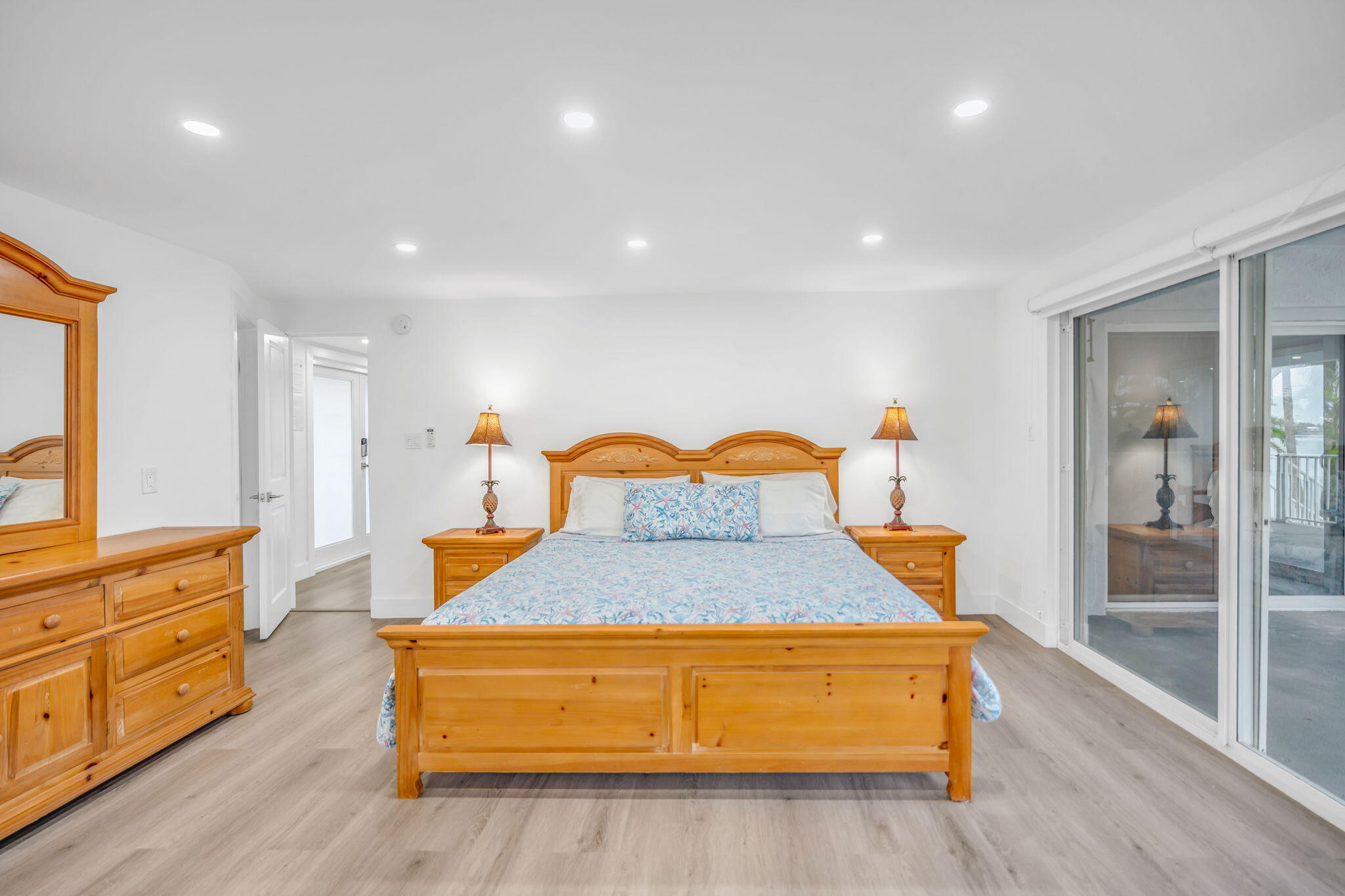 82 Tingler Lane Marathon, FL 33050 - Photo 16 of 54 a bedroom with a bed and wooden floor