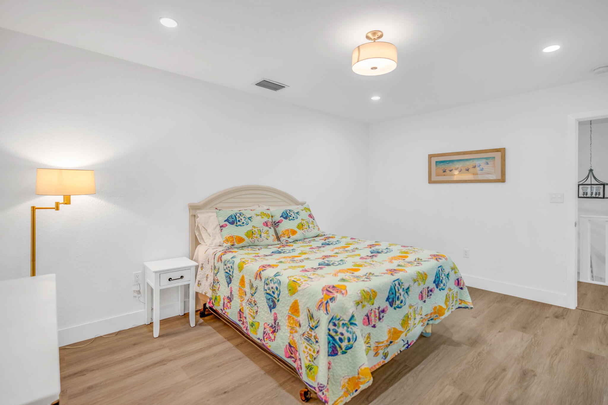 82 Tingler Lane Marathon, FL 33050 - Photo 19 of 54 a bedroom with a bed and a lamp