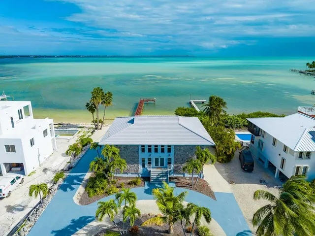 an aerial view of a house with outdoor space patio and outdoor seating