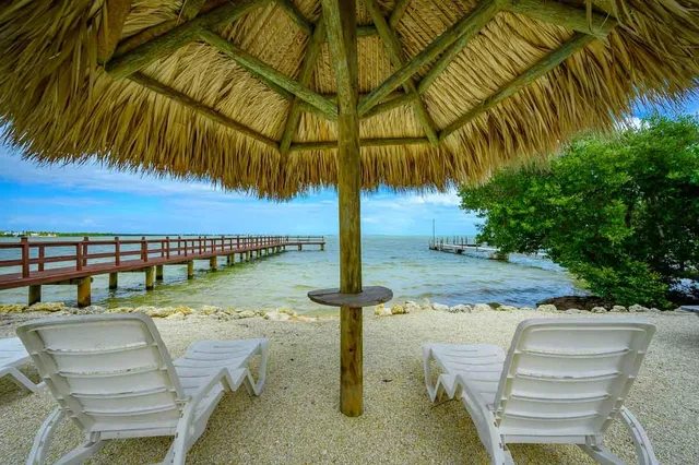 a view of a lake from a balcony with outdoor space