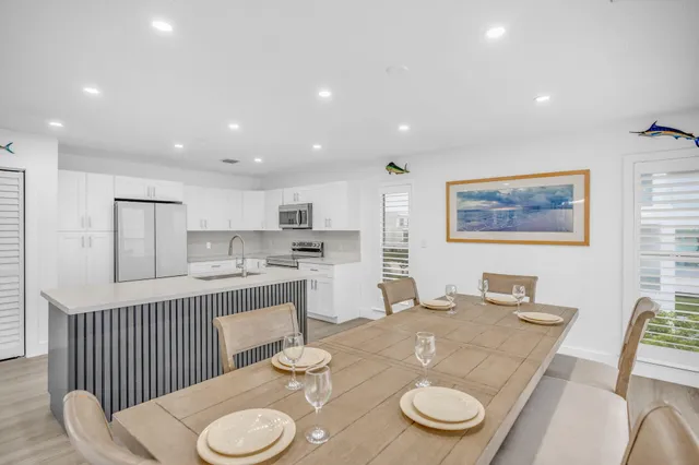 a living room with kitchen island furniture and a wooden floor