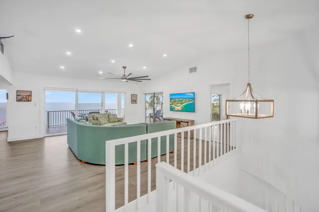 a room with furniture entryway and wooden floor