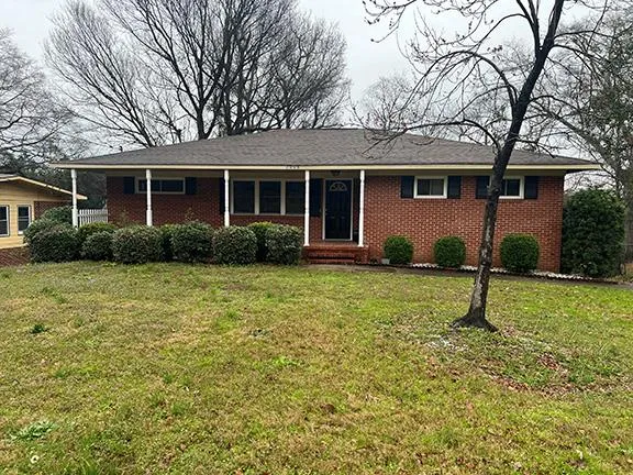 a house view with a garden space