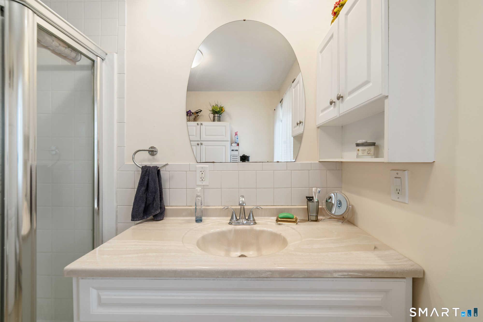 146 Highland Drive Waterbury, CT 06708 - Photo 12 of 31 a bathroom with a sink and a mirror