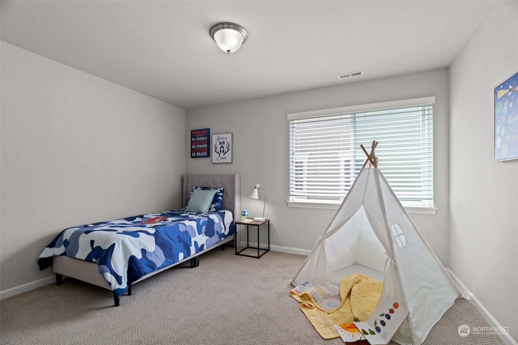18619 45th Avenue Southeast Bothell, WA 98012 - Photo 25 of 38 a bed sitting in a bedroom next to a window