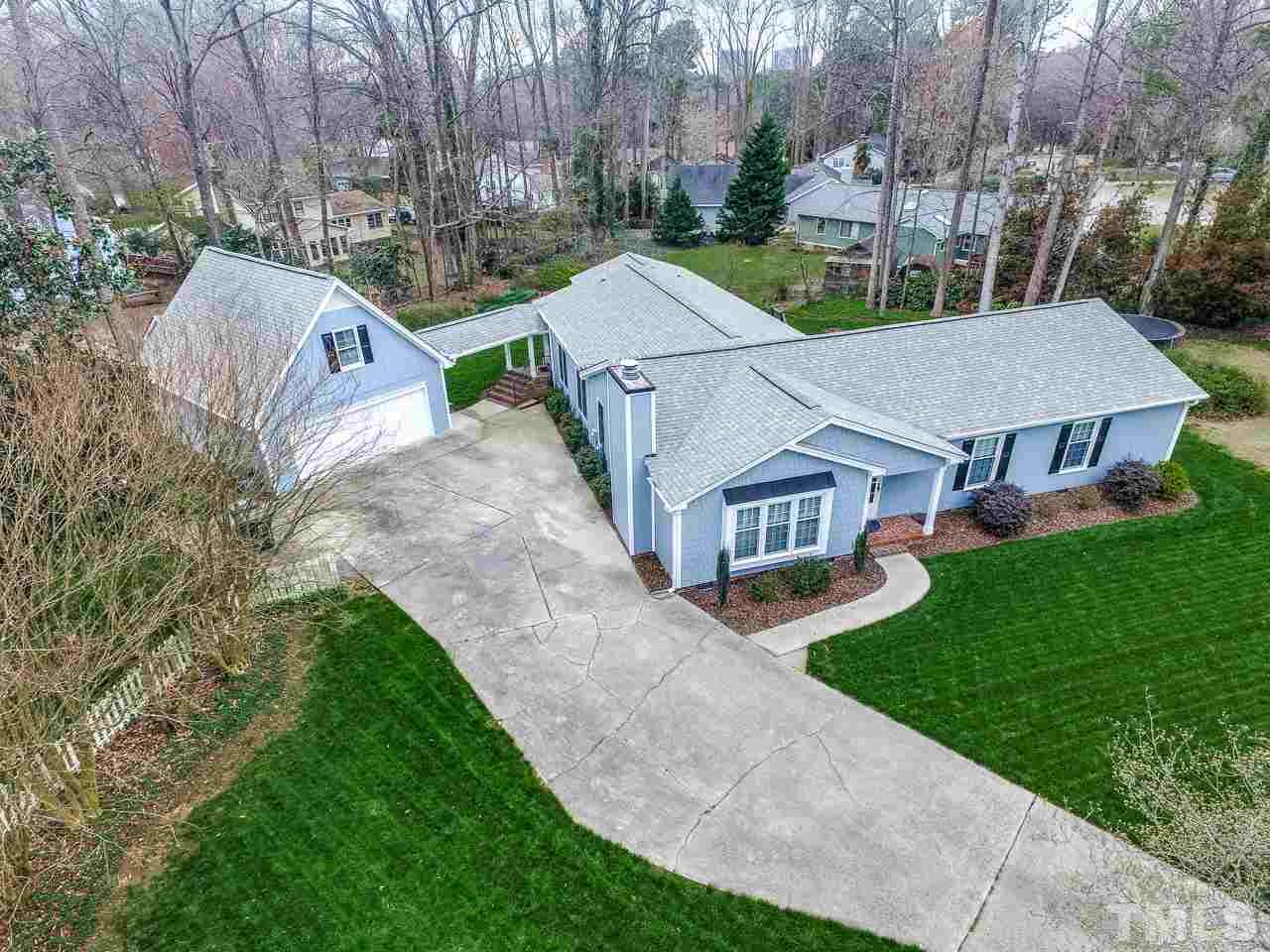 4201 Frost Court Raleigh, NC 27609 - Photo 1 of 25 a aerial view of a house next to a big yard and large trees