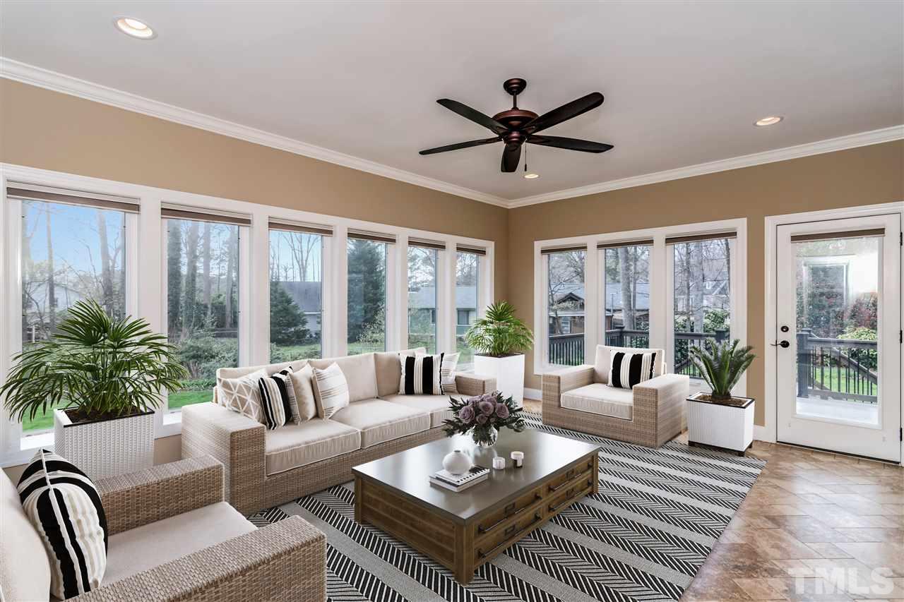 4201 Frost Court Raleigh, NC 27609 - Photo 15 of 25 a living room with furniture and a large window