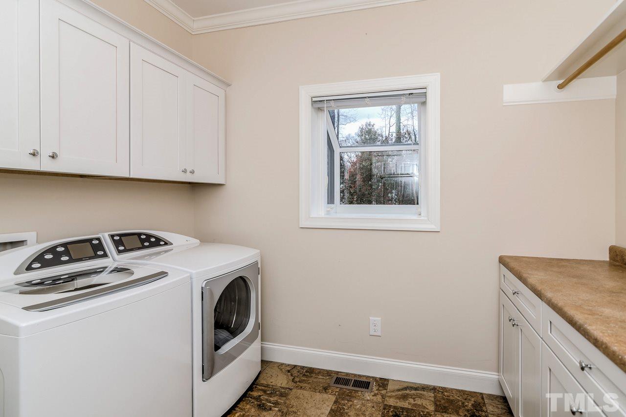 4201 Frost Court Raleigh, NC 27609 - Photo 20 of 25 a utility room with dryer and washer
