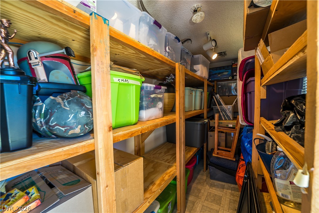 1324 Appaloosa Road Boulder City, NV 89005 - Photo 38 of 42 Ample wooden shelving provides abundant storage for organized living.