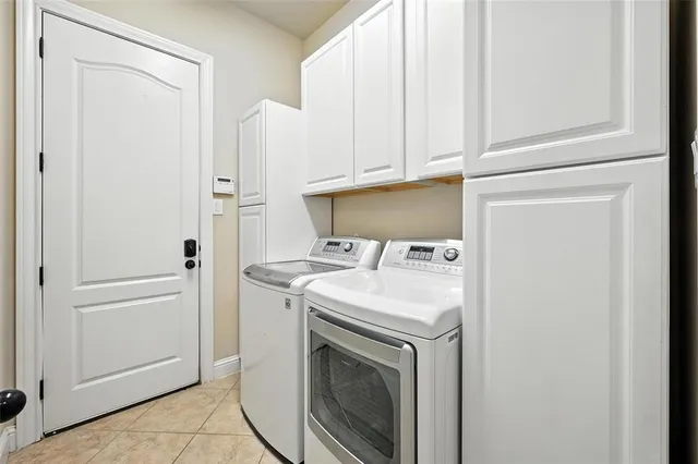 a kitchen with a sink a counter top space stainless steel appliances and cabinets
