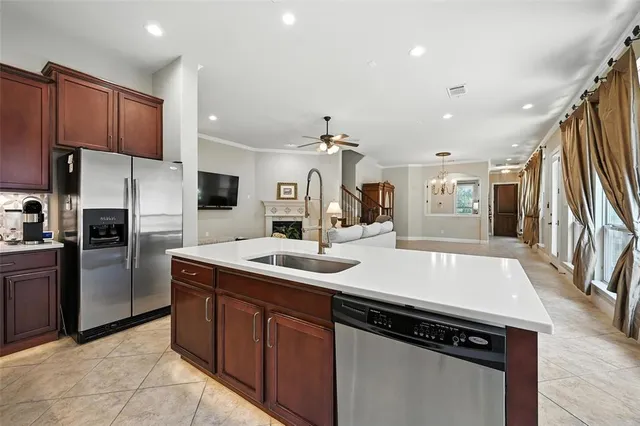 a kitchen with a sink cabinets and stainless steel appliances