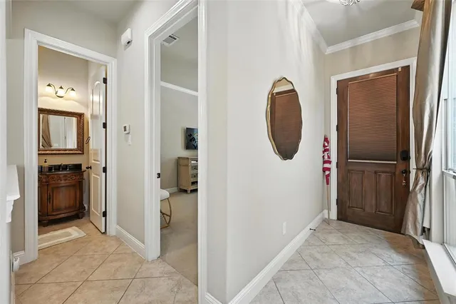 a living room with a couch and a chandelier