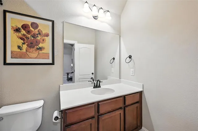 a view of a livingroom with furniture and a flat screen tv