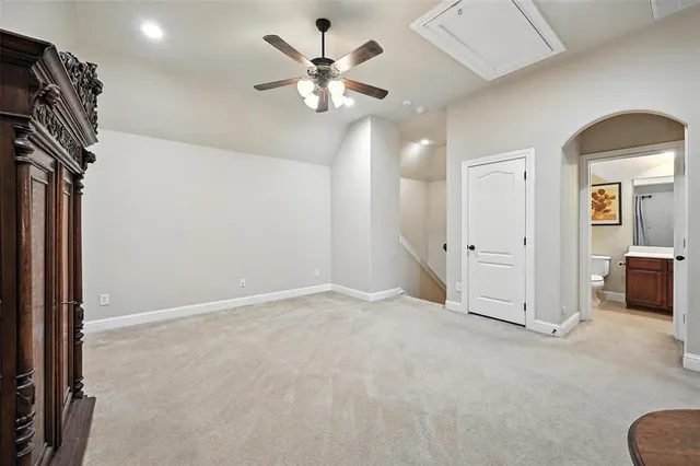 a view of workspace with chandelier fan