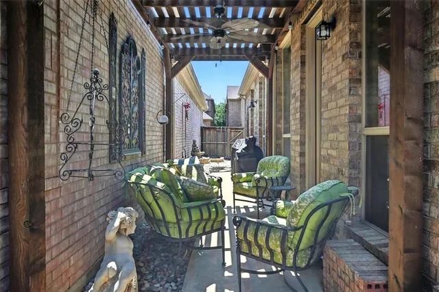 a front view of a house with a garden and yard