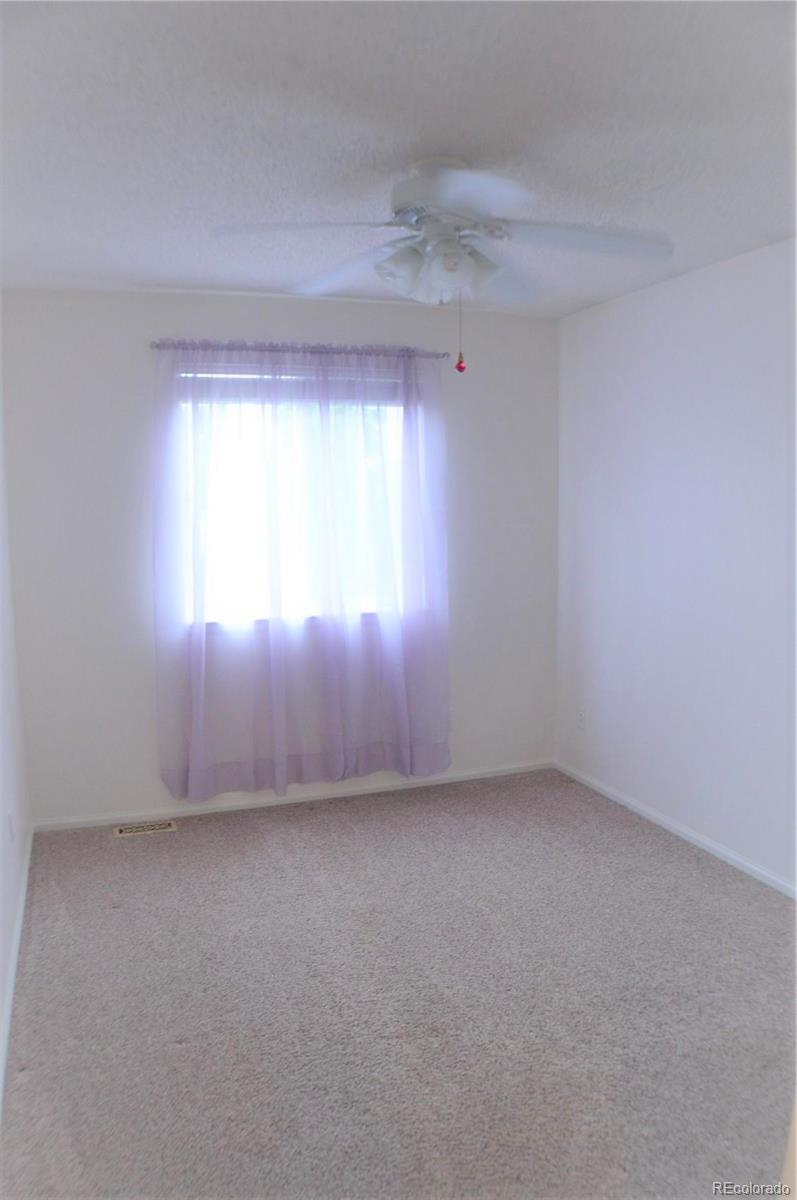 1149 Timbervale Trail Highlands Ranch, CO 80129 - Photo 26 of 32 an empty room with a window