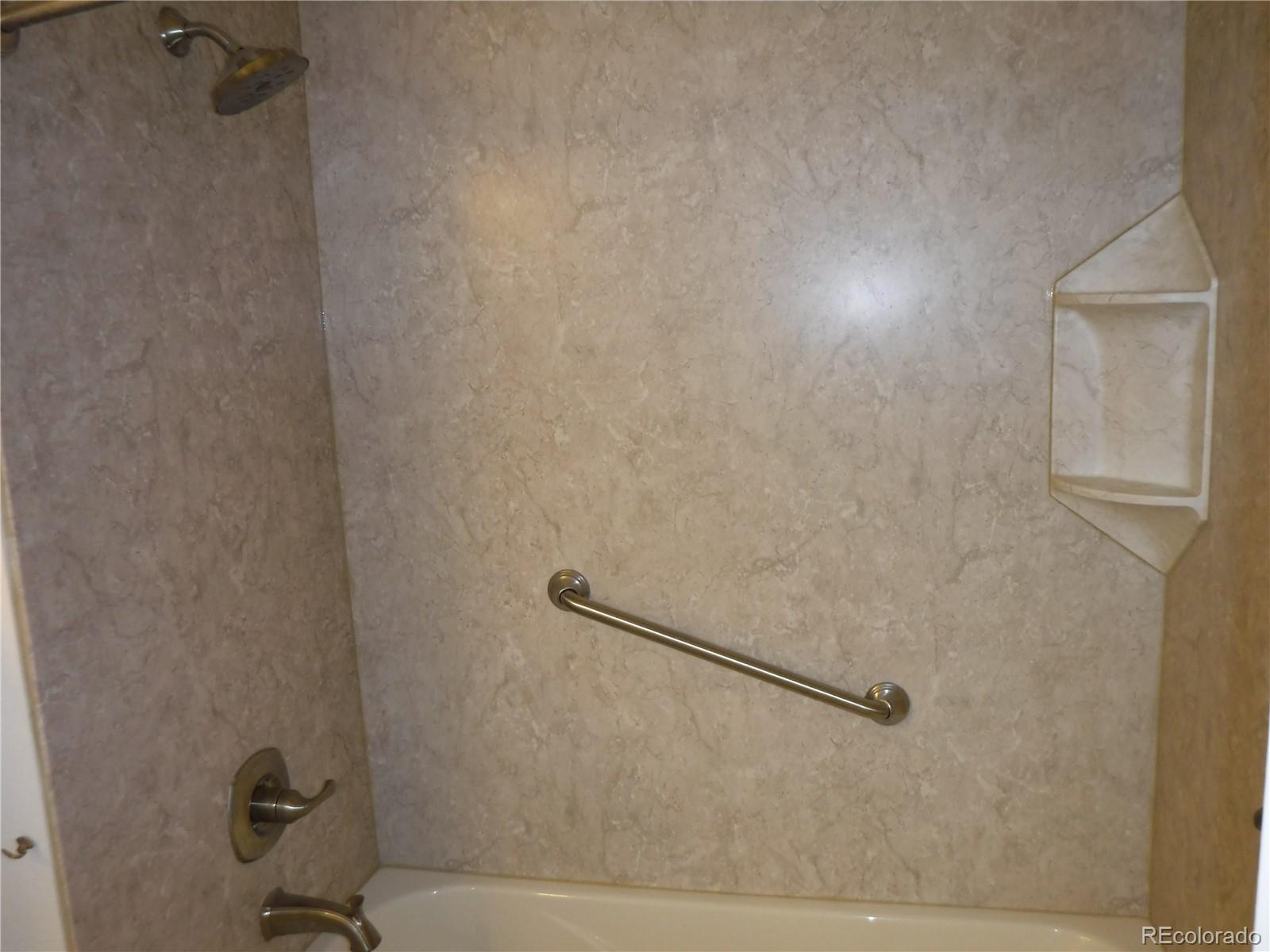 1149 Timbervale Trail Highlands Ranch, CO 80129 - Photo 28 of 32 a bathroom with a bathtub