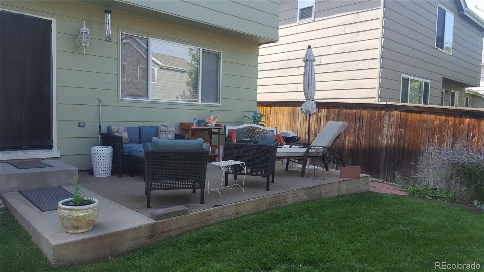 1149 Timbervale Trail Highlands Ranch, CO 80129 - Photo 3 of 32 a view of a house with backyard and a sitting area