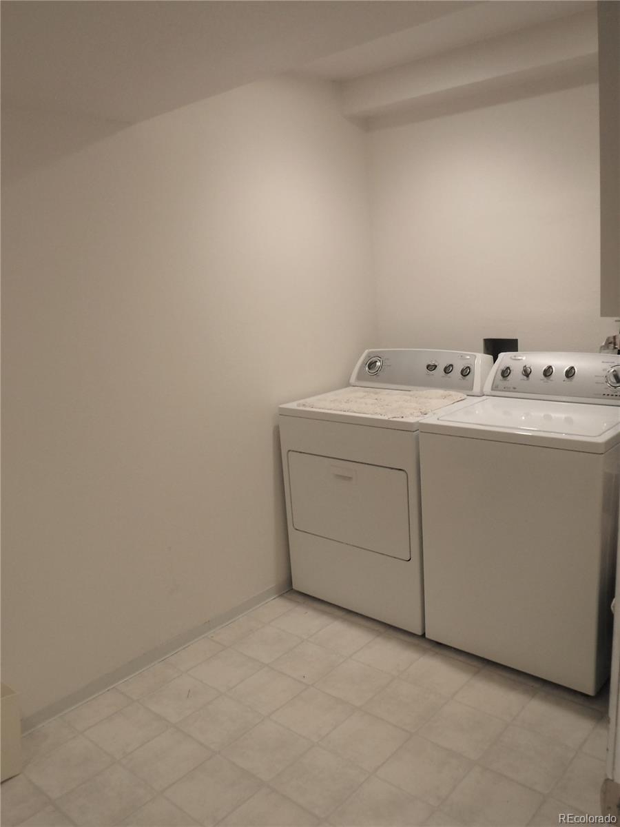 1149 Timbervale Trail Highlands Ranch, CO 80129 - Photo 32 of 32 a utility room with dryer and washer