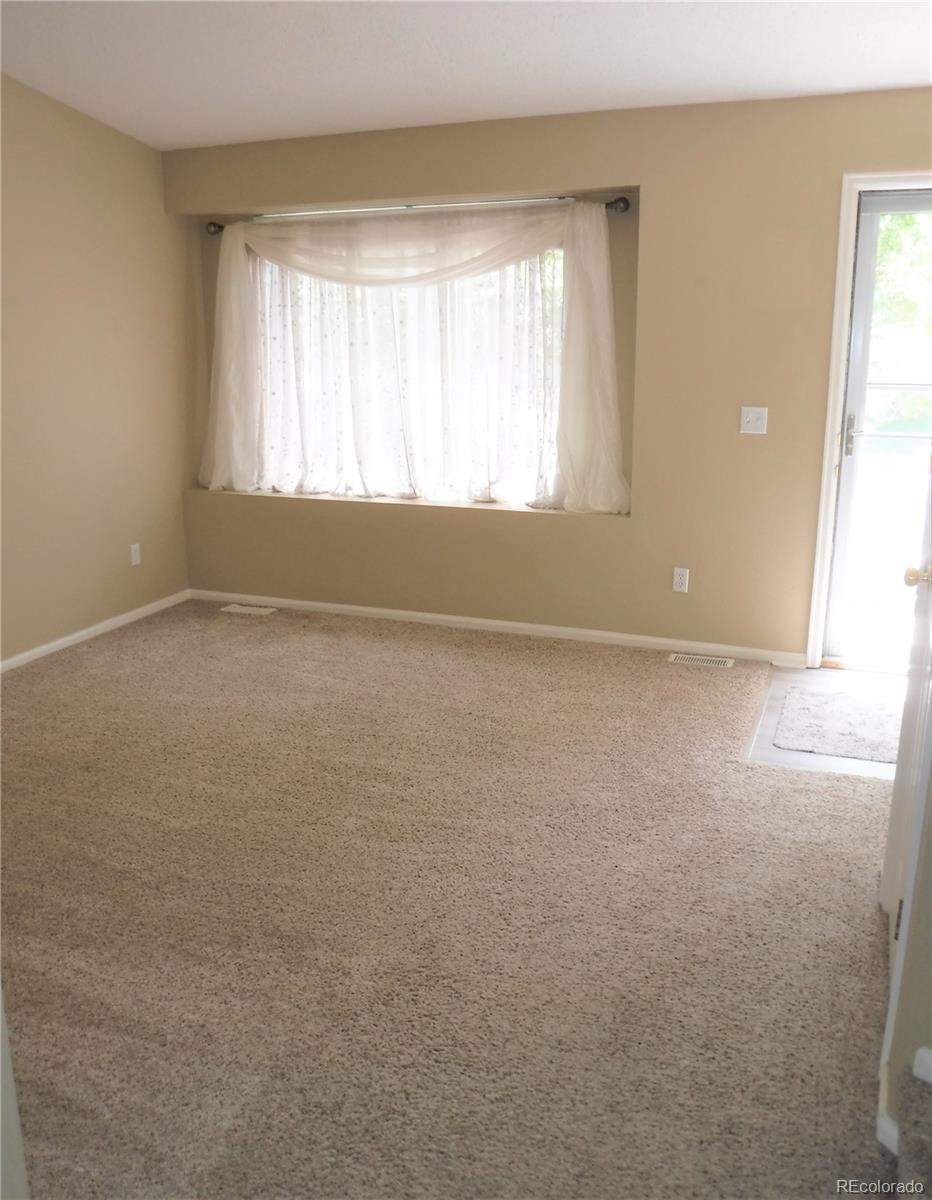 1149 Timbervale Trail Highlands Ranch, CO 80129 - Photo 9 of 32 an empty room with window