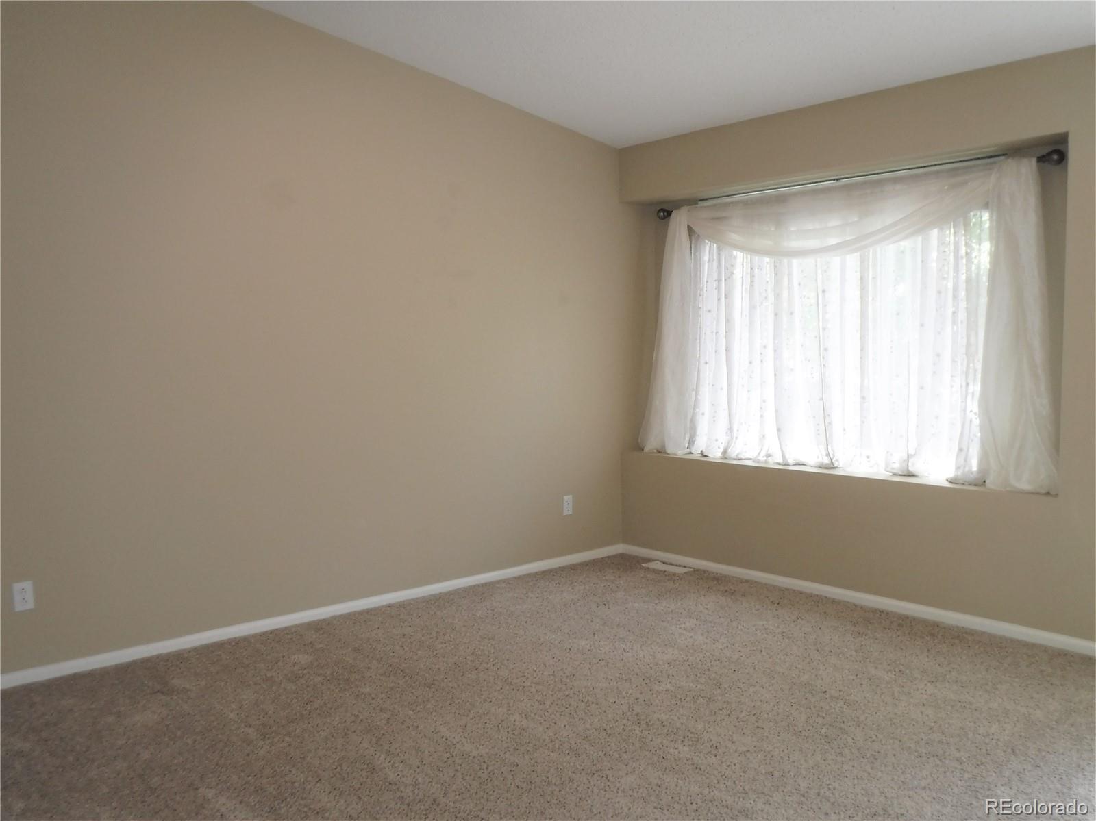 1149 Timbervale Trail Highlands Ranch, CO 80129 - Photo 10 of 32 an empty room with a window