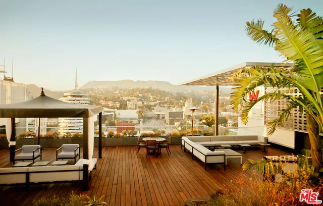 a view of a swimming pool with a table and chairs