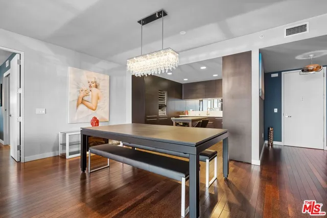 a view of a kitchen with dining table and chairs