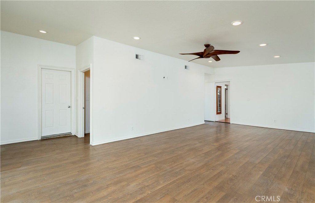 10161 Foothill Boulevard Sylmar, CA 91342 - Photo 14 of 65 a view of empty room with wooden floor