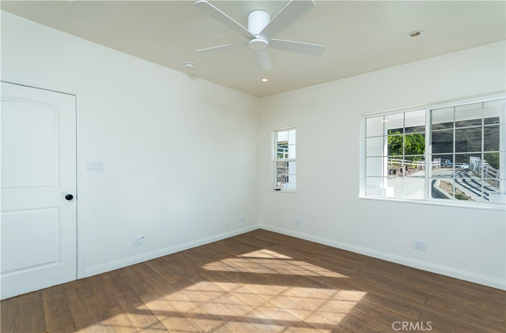 10161 Foothill Boulevard Sylmar, CA 91342 - Photo 23 of 65 a view of empty room with wooden floor and fan