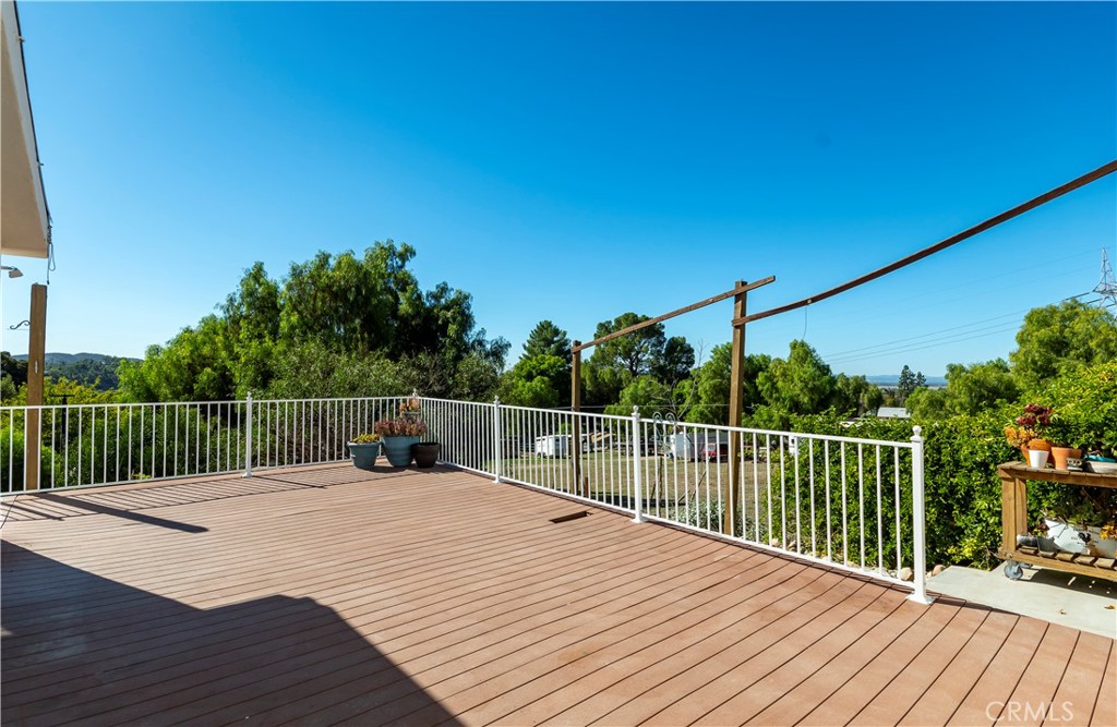 10161 Foothill Boulevard Sylmar, CA 91342 - Photo 25 of 65 a view of balcony with wooden floor and fence