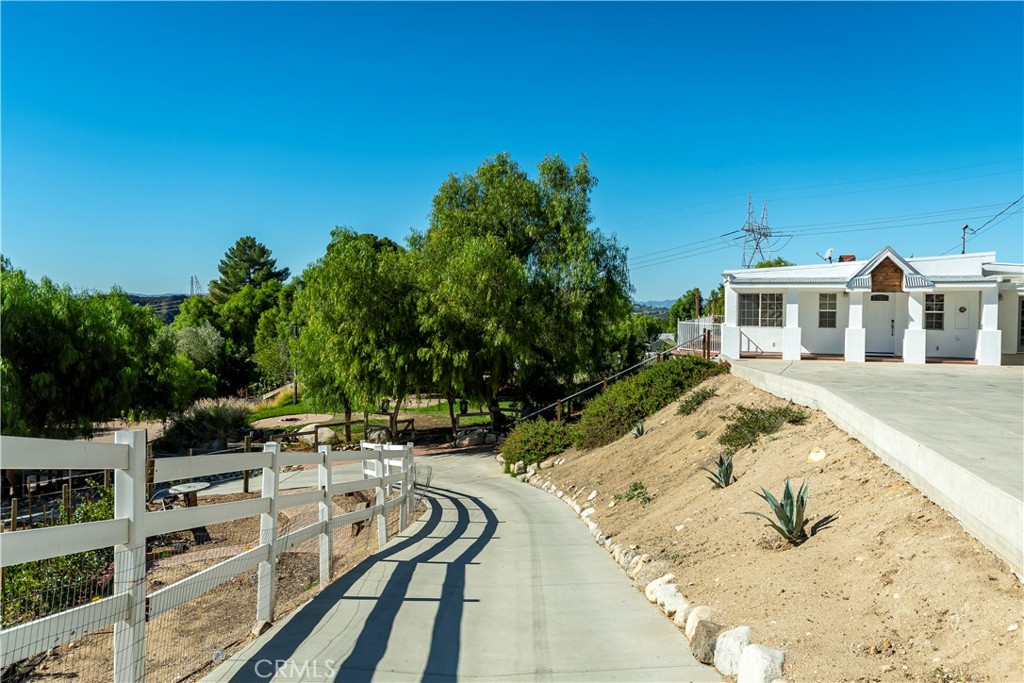 10161 Foothill Boulevard Sylmar, CA 91342 - Photo 29 of 65 a view of a swimming pool with an outdoor seating