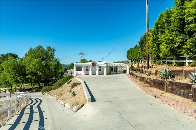 a view of a swimming pool with a outdoor space and seating area
