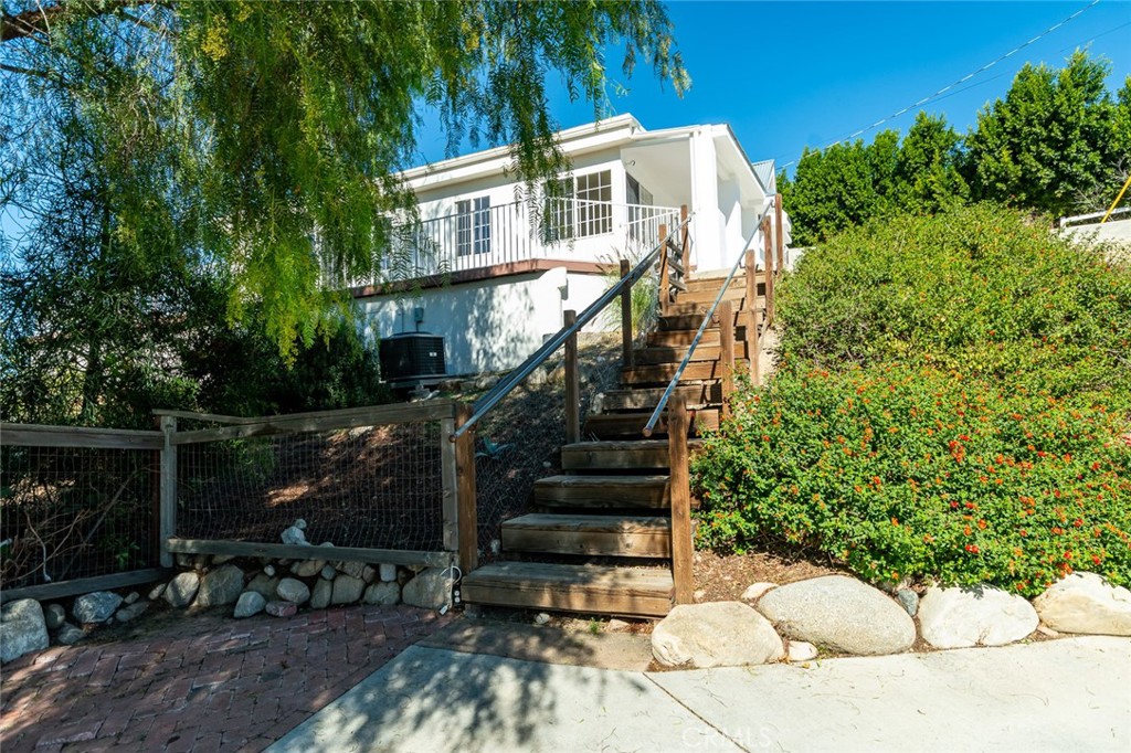 10161 Foothill Boulevard Sylmar, CA 91342 - Photo 32 of 65 a view of a house with backyard and sitting area