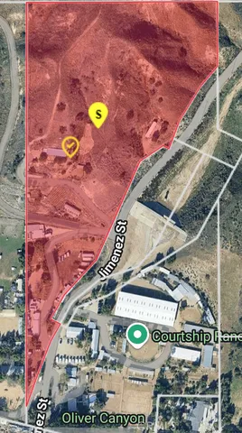 a view of empty room with wooden floor and fireplace