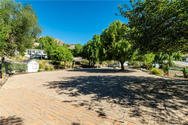 a view of backyard with sitting area