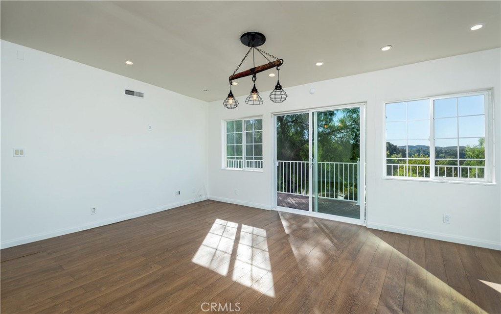 10161 Foothill Boulevard Sylmar, CA 91342 - Photo 7 of 65 a view of an empty room with a window