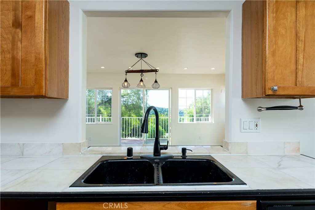 10161 Foothill Boulevard Sylmar, CA 91342 - Photo 9 of 65 a kitchen with a sink and a window