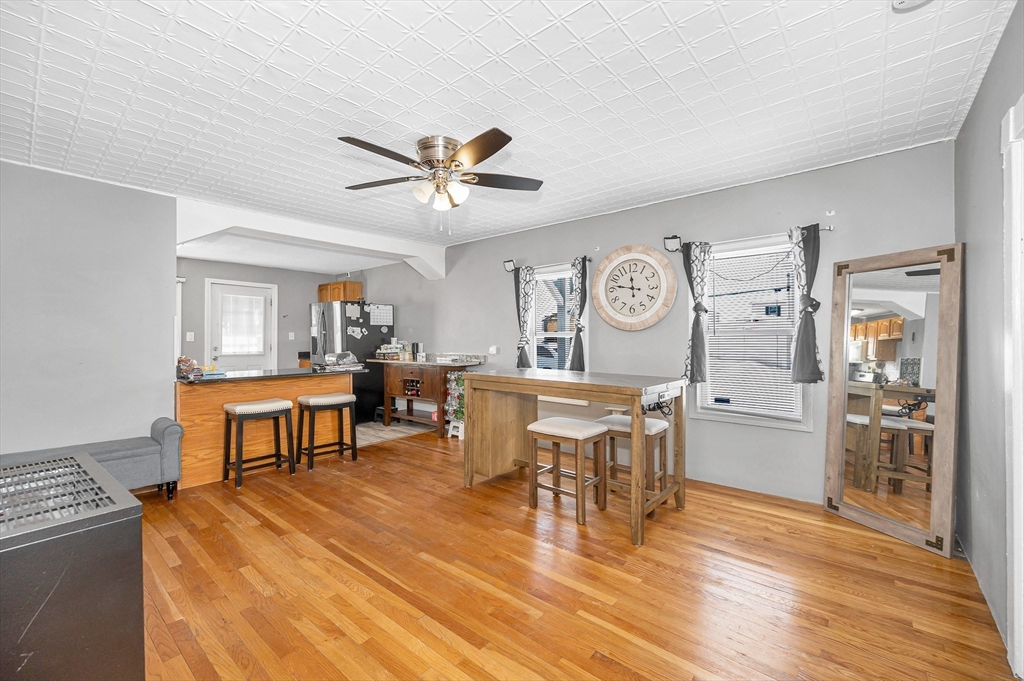 11 Sutherland Street Lowell, MA 01850 - Photo 7 of 33 a view of a a dining room with furniture window and wooden floor