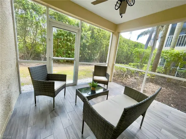 a view of a dining room with furniture wooden floor and a potted plant